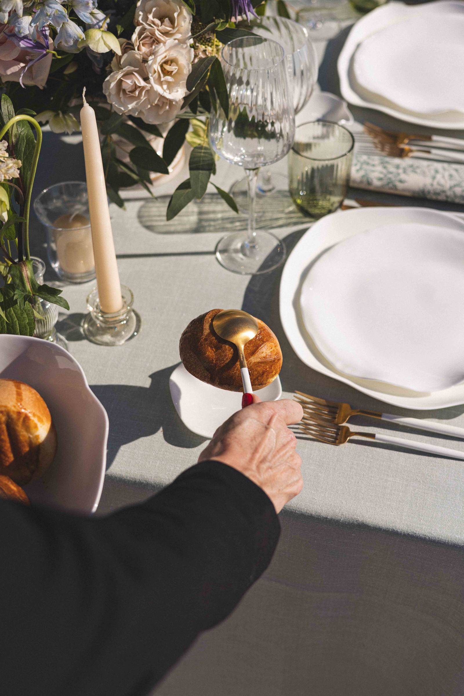Bread served with tongs, at the table